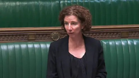 Parliament UK Labour (Co-op) MP for Oxford East Dame Anneliese Dodds speaking at the House of Commons. She is wearing a black outfit. She is looking to her right, away from the camera.