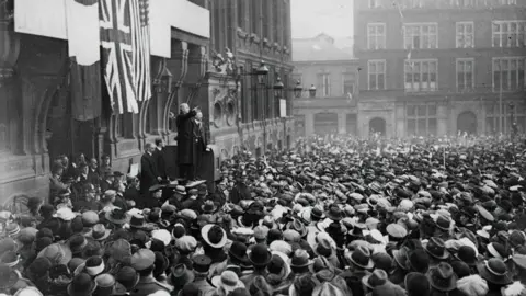 Leicester City Council: Story of Leicester A black and white image showing crowds gathered for the opening of the Town Hall