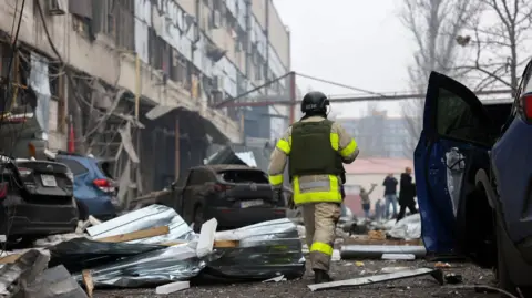 Emergency Services Dnipropetrovsk A firefighter walks amid the debris