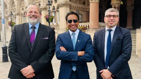 Zia Yusuf with Council Leader Mark Arnull, Deputy Leader James Petter and the Reform UK cabinet on West Northamptonshire Council