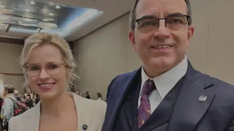 Christina Mackaill Christina Mackaill and Dr James Polk smiling at the camera. 