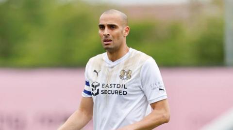 Close-up of Leyton Orient midfielder Darren Pratley in his white kit during a game