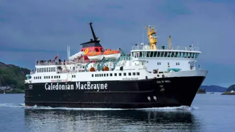 A large black and white ferry with red funnels