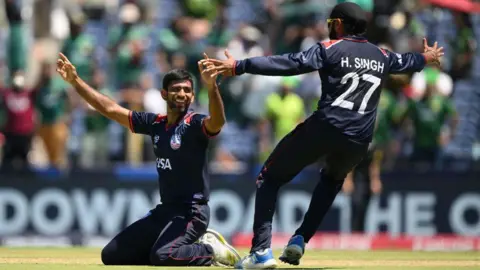 Saurabh Netravalkar of USA celebrates with teammate Harmeet Singh after USA defeat Pakistan in a super over during the ICC Men's T20 Cricket World 