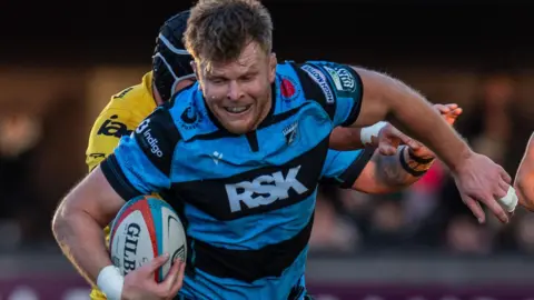 Josh McNally carries the ball for Cardiff
