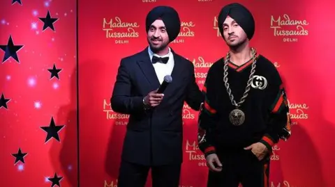 Getty Images Diljit Dosanjh during the unveiling of his wax statue at Madame Tussauds Museum, on March 28, 2019 in New Delhi, India