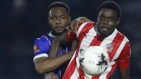 Justin Amaluzor (right) in action for Altrincham
