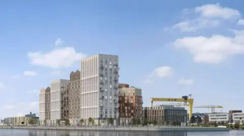 Todd architects Apartments seen across a river. The Harland and Wolff cranes are along the skyline.