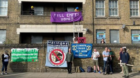 Campaigners outside flats
