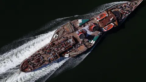 PA Media Birds-eye-view of the Waverley, sailing across the ocean with lots of passengers on deck.