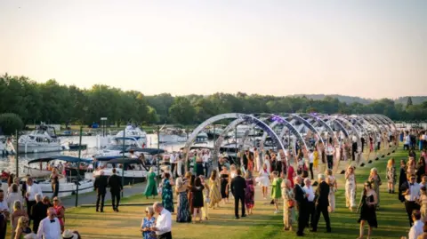 Garry Jones Henley Festival outside area with large crowd milling about.