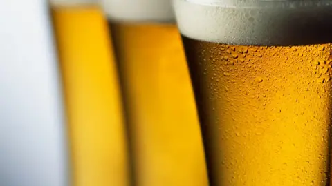 Three beers of lager, close up.