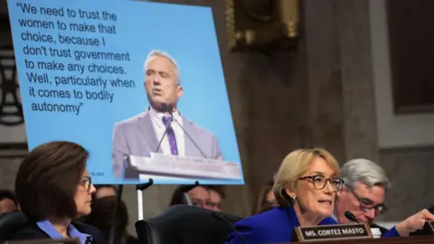 Getty Images A motion   held up   astatine  the confirmation proceeding  showing a punctuation  by Kennedy, successful  which helium  says "We request   to spot    women to marque   that choice."