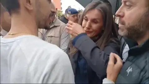 Queen Letizia, with mud on her face, cries as she visits Paiporta in flood-hit Valencia