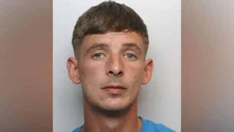 A police custody image of Kieron Oldham