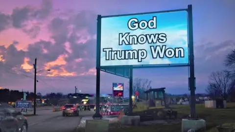 Getty Images 'God knows Trump won' sign