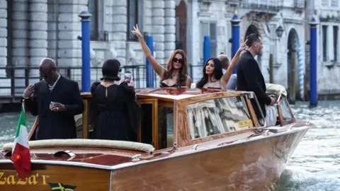 Reuters Kim and Khloe Kardashian pout and make a 'v' sign with their fingers as their mother Kris Jenner snaps a picture on a boat in Venice.