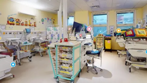King’s College NHS Foundation Trust A room with cots and incubators covered with patchwork blankets, with animal stickers on the walls