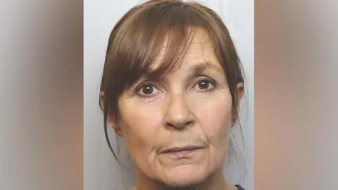 Cheshire Constabulary Police custody image of Joanne Sharkey with brown hair and brown eyes.