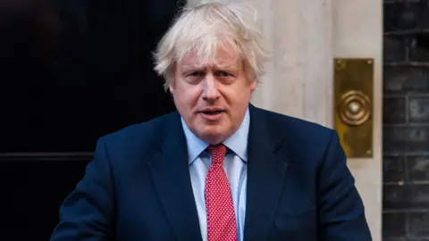 Getty Images British Prime Minister Boris Johnson claps his hands outside 10 Downing Street during the weekly 'Clap for our Carers' applause for the NHS and key workers on the front line of the coronavirus (Covid-19) pandemic on 28 May, 2020 in London, England. The founder of the event, Ms Annemarie Plas, suggested that after the 10th applause this week, the show of appreciation should be made an annual event to avoid it being politicised.