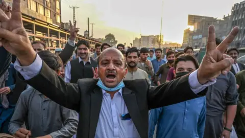 Getty Images Pakistan Tehreek-e-Insaf (PTI) party activists and supporters of Pakistan's former Prime Minister Imran Khan celebrate in Peshawar after the Supreme Court acquitted Khan