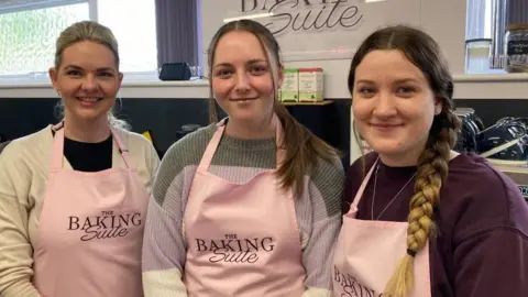 Alex Pope/BBC Kimberley White (left), Chloe Frost and Rosie Harrington at The Baking Suite