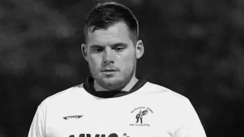 Jez Tighe/PA Media The picture is a black and white photo of Jordan Sinnott