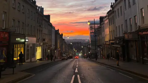 A picture of a sunrise, taken down Park Street in Bristol.