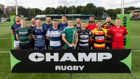 Club captains, from left, Bailey Ransom of London Scottish, David Williams of Nottingham, Alex Everett of Cornish Pirates, Alex Day of Bedford Blues, Matt Rogerson of Worcester Warriors, Jordon Poole of Coventry, Ben Murphy of Doncaster Knights, Angus Kernohan of Ealing Trailfinders, JJ Dickinson of Caldy, Luke Carter of Chinnor, Otumaka Mausia of Cambridge, Alex Schwarz of Richmond, Fraser Strachan of Ampthill and Will Crane of Hartpury during the Championship Rugby media day at Trailfinders Sports Club on September 24, 2025 in London, England.