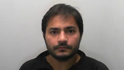 North Yorkshire Police A police mugshot of Sahil Nagpal, who has short dark hair and dark facial hair.