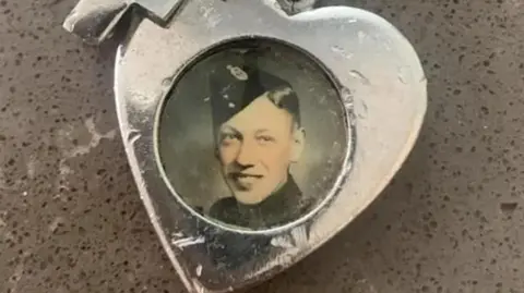 Claire Stonier Silver heart-shaped fob containing a round photograph of a young man in military uniform