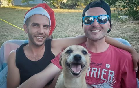 Jason, his partner Nick Rowlands and Milo in between them