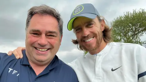 Norman Marshall Norman and Tommy smiling in a selfie.