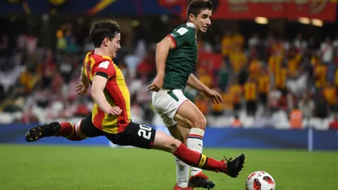 Ayman Ben Mohamed makes a tackle at the Club World Cup