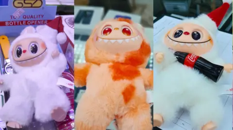 Three fake Labubu dolls - plush fury toys each with big eyes and a row of teeth