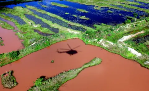 EPA The shadow of a helicopter seen in an area rich in diamonds in northern Angola - Saturday 20 October 2018