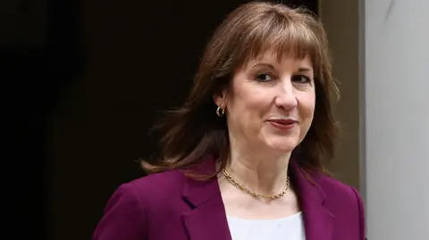 British Chancellor of the Exchequer Rachel Reeves walks outside 11 Downing Street in London, Britain, March 4, 2026. She is wearing a purple blazer over a white top.