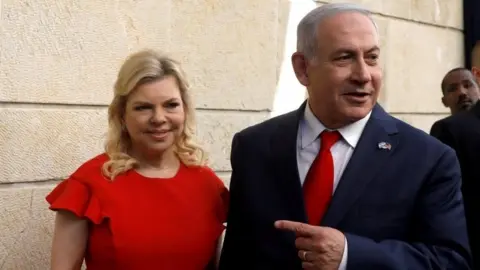 Reuters Israeli Prime Minister Benjamin Netanyahu (right) and his wife Sara. File photo