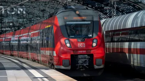 A DB Deutsche Bahn passenger train is seen at the Berlin Hauptbahnhof main railway station in Berlin.