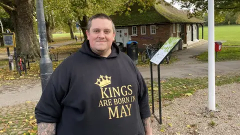 Jozef Hall/BBC Man outside toilet