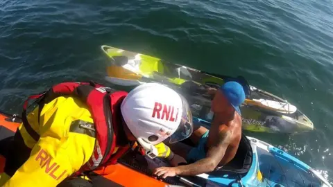 RNLI Porthcawl RNLI volunteer pulls kayaker to safety off Porthcawl