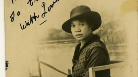 Fred Petersen / Glamorgan Archives  A woman sitting on a chair