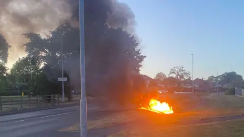 Our Bassetlaw A motorcycle well alight on the side of a road