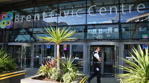 Police officers at the scene of a fatal stabbing at Brent Civic Centre in Wembley.