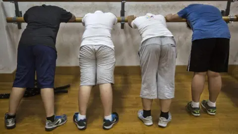 Getty Images Overweight Chinese students at a training camp in Beijing, July 2014.