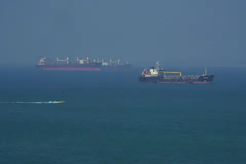 Getty Images Tankers on an open sea on a slightly misty day on the Strait of Hormuz, as seen from Iran's Qeshm island.