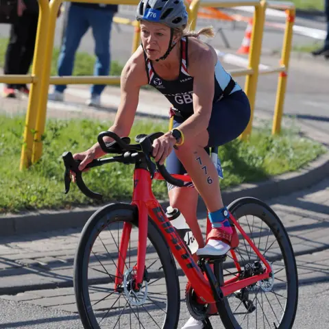 Jackie Roach Photography Zoe rides the now stolen red racing bike in a competition.