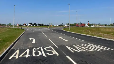 A road with white lines saying A46 (S) and A46 (N)