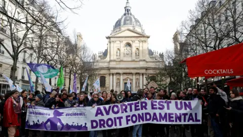 Reuters On 28 February, people held a banner which read "Abortion is a fundamental right" during a demonstration organised by the collective "Abortion Europe, women decide"