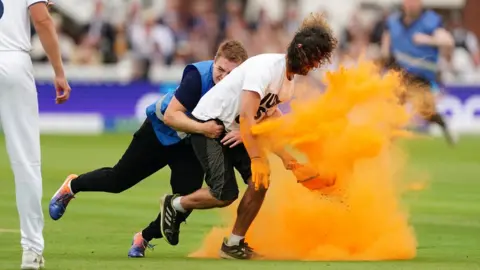 PA Media Just Stop Oil protester Jacob Bourne is grabbed by security